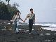 [Pic:
 Walking on black sand] 